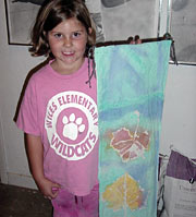 young girl holding watercolor painting